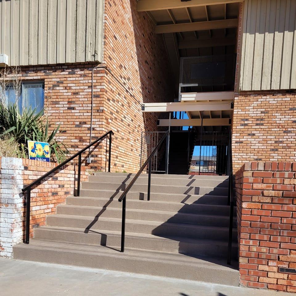 stairs leading into village square apartments 